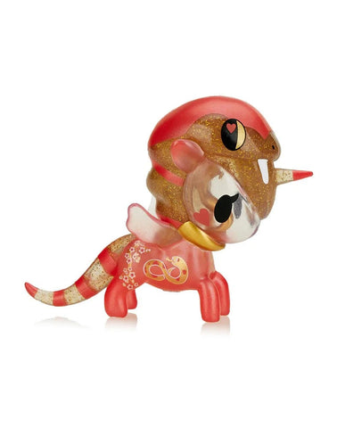 The tokidoki Year of the Snake - Charmer Unicorno is a small red and gold toy with a snake head and tail, glitter accents, and heart-shaped eyes, shown on a white background to honor the Chinese Zodiac Year of the Snake.