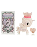 The Tokidoki Precious Unicorno - Pink Aura Amethyst figurine, featuring a crystal crown and heart-shaped crystal, exudes healing properties. The decorative card labeled