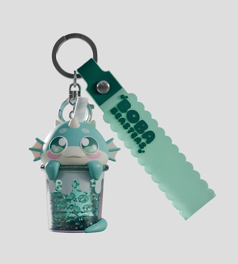 The Boba Beasteas Blind Box by Kaleidos Creative features a cute cartoon cryptid sitting in a translucent beaded cup with a teal