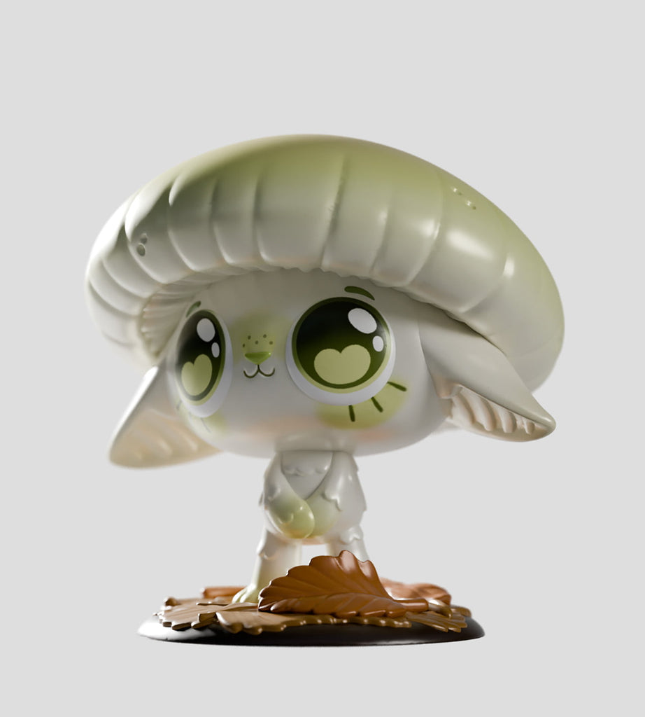 Vinyl figurine from the Capkins Series 1 Blind Box by Kaleidos Creative, featuring a cute, wide-eyed creature with large ears and a mushroom cap hat standing on leafy base, inspired by the magical Fungi Forest. Plain gray background.