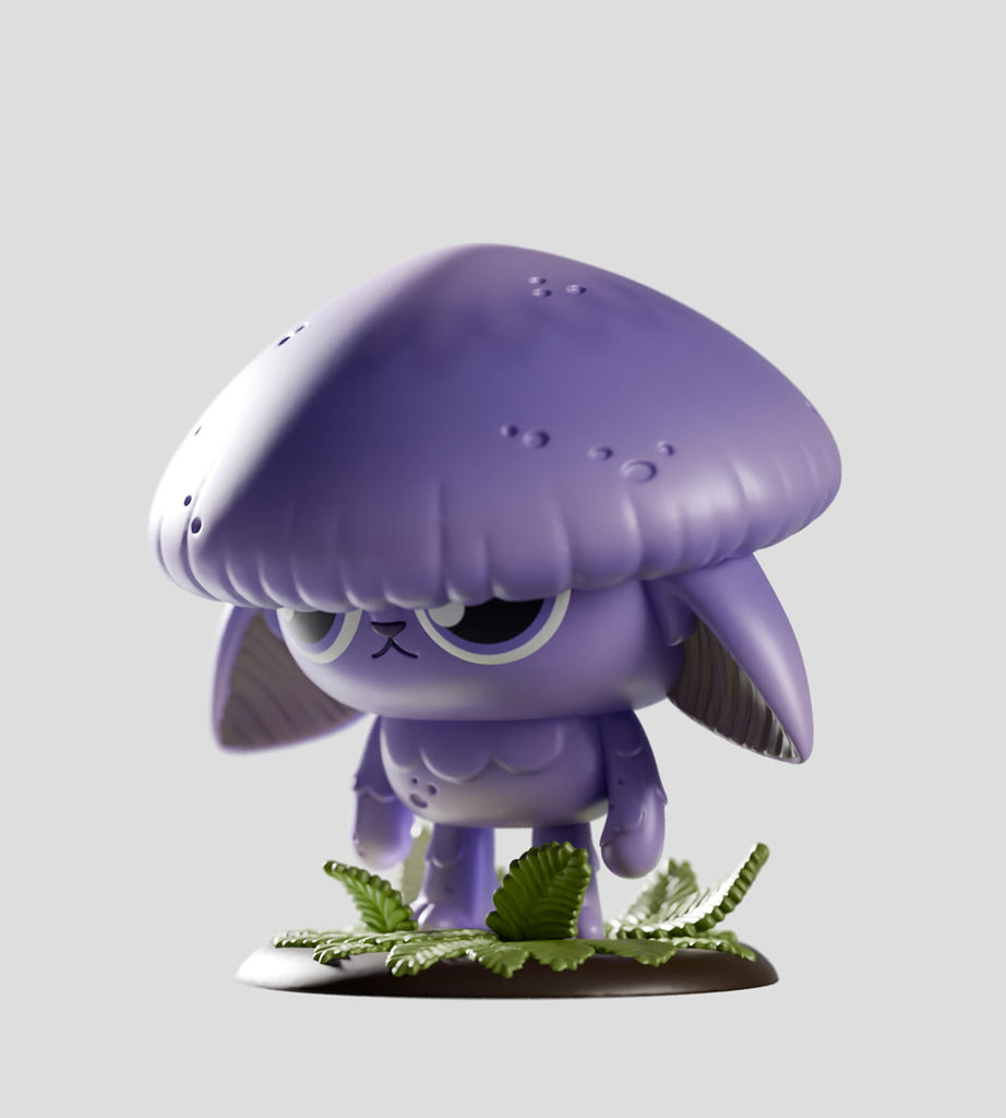 A Kaleidos Creative Capkins Series 1 Blind Box figurine—a purple character with a mushroom-shaped head and droopy ears—stands on green leaves, inspired by Fungi Forest, against a plain gray background.
