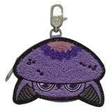 The Capkins Mystery Coin Bag by Kaleidos Creative is a collectible keychain with an embroidered purple crab design, large eyes, and a metal clasp at the top.