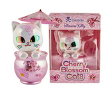 A Tokidoki Cherry Blossom Cats - Special Edition Blossom Kitty figurine features a white cat with holographic eyes in a pink cup holding a parasol, displayed next to its branded packaging.