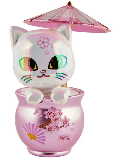 The Tokidoki Cherry Blossom Cats - Special Edition Blossom Kitty features a shiny white figurine with multicolored eyes sitting in a pink, cherry blossom-themed cup and holding a pink umbrella—a must-have for collectors.