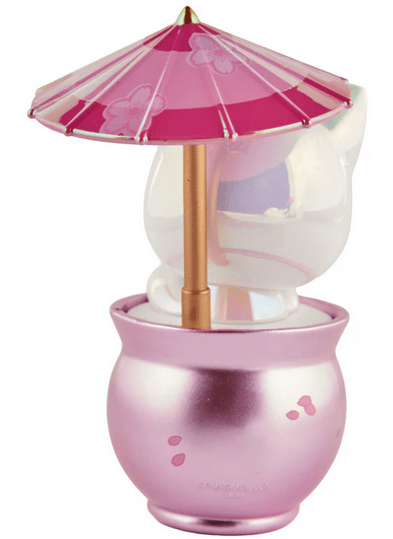 The Tokidoki Cherry Blossom Cats - Special Edition Blossom Kitty features a white cat figurine with a pink and red umbrella, seated in a metallic pink pot adorned with small paw prints.