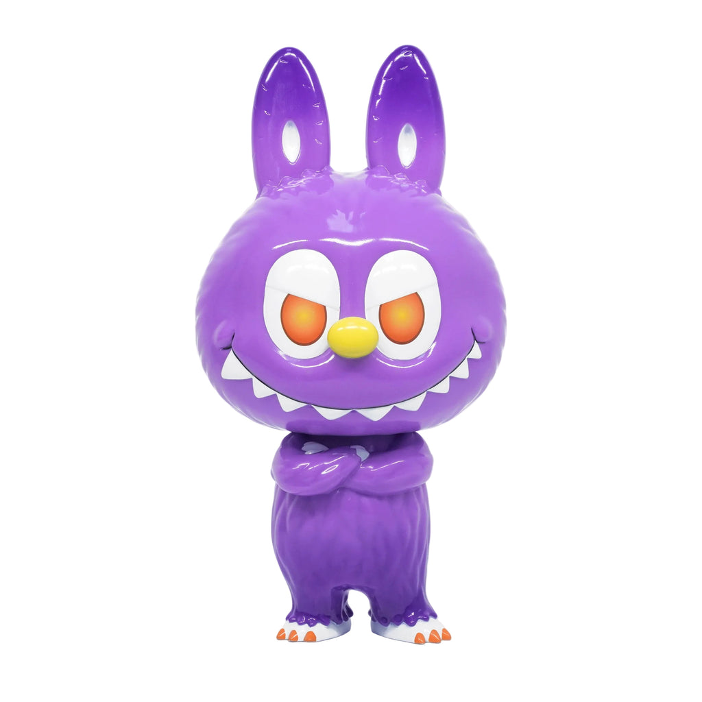 The Cowawa — MET by How2Work is a shiny purple cartoon creature with bunny ears, orange and red eyes, a yellow nose, sharp teeth, and crossed arms standing facing forward.
