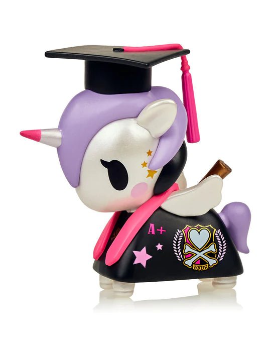 A Graduation Unicorno by tokidoki proudly wearing a graduation hat, symbolizing achievement.
