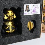 A Hungry Hamster — An Evil Thought skeleton figurine in a box.