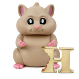 The limited edition toy hamster, Hungry Hamster — The Original, is sitting next to a letter h.
