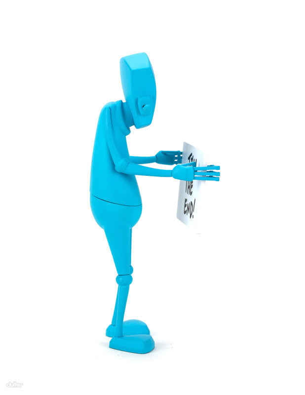 A blue Chris RWK robot figure by Rotofugi stands in profile, holding a white sign that reads