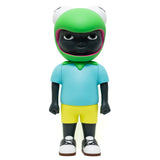Introducing the limited edition Phibby — OG (Green) vinyl figurine of a black character wearing a frog hat, a light blue shirt, yellow shorts, and white shoes. Designed by Hebru Brand (US).