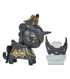 The Tokidoki Unicorno After Dark Masquerade Blind Box features a black and gold collectible toy with a fancy hat and skirt, displayed beside a decorative mask on a clear stand—an enchanting pick for collectors.