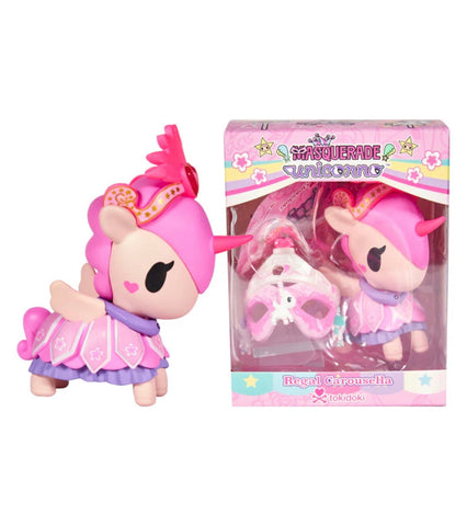 A pink and purple unicorn figurine with a mask stands by its colorful box labeled "Unicorno After Dark Masquerade - Regal Carousella (Special Edition)," a collectible by Tokidoki.