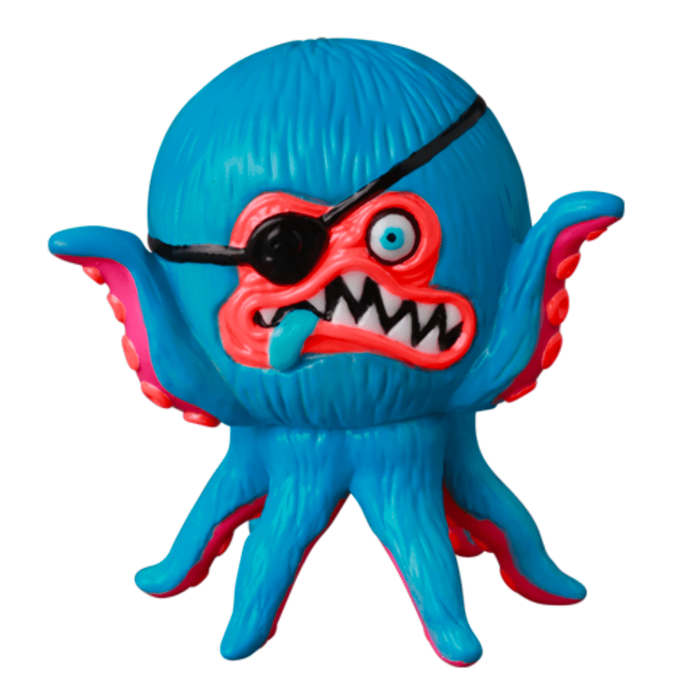 The VAG 40 β AHOY by Shelterbank, a vibrant Japanese vinyl toy from Medicom (JP), showcases an octopus-like creature adorned with an eyepatch, sharp teeth, and a protruding tongue. This colorful figure features blue, red, and pink hues and is a charming addition to the world of Vinyl Artist Gacha collectibles.