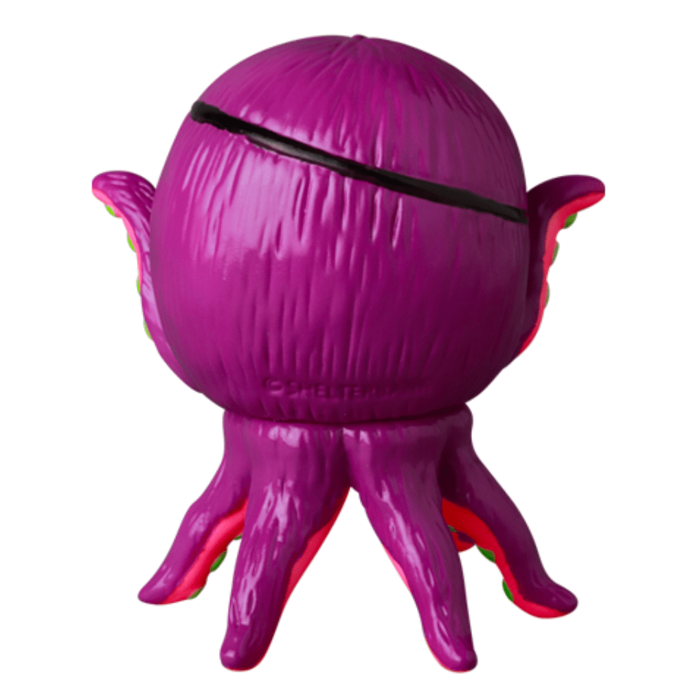 The VAG 40 β AHOY by Shelterbank from the Medicom (JP) brand is a purple, octopus-shaped toy featuring a spherical head and stubby tentacles. It is styled in the manner of Japanese vinyl toys and boasts a smooth, shiny texture that evokes the appearance of collectible gachapon figures.