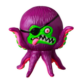 The VAG 40 β AHOY by Shelterbank from Medicom (JP) is a delightful Japanese vinyl toy featuring a purple, one-eyed, octopus-like design. It showcases a charming green face, a playful eyepatch, and sticks out its tongue, capturing the whimsical appeal found in Vinyl Artist Gacha gachapon figures.