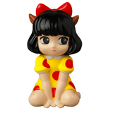 Drawing inspiration from gachapon figures, the VAG 40 β Zombiecats Story Morimeiworks Nekomusume by Medicom (JP) is a cartoonish figurine depicting a girl with black hair, a red bow, and a yellow dress decorated with red polka dots. With her pensive expression while sitting on the floor, this piece would be cherished by vinyl toy artists.