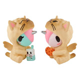 Discover the Tokidoki Twinsies Unicorno Blind Box by tokidoki—two cute Unicornos in cat costumes, one with a milk carton and the other with a cookie, perfect for fans of collectible surprises!.