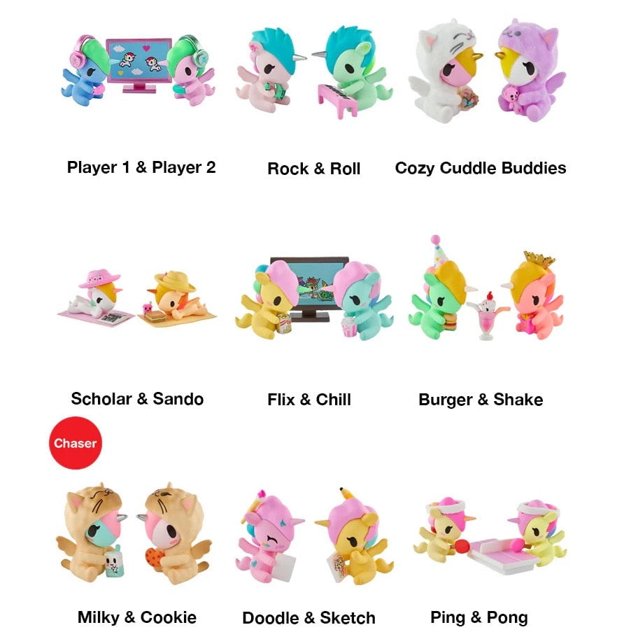 Nine pairs of pastel animal figurines from the tokidoki Twinsies Unicorno Blind Box are arranged in three rows, each themed and labeled—like Player 1 & Player 2 or Rock & Roll—evoking the charm of collectible tokidoki surprises.