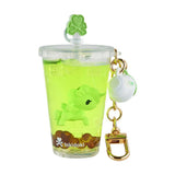 Show off your love for tokidoki with this collectible keychain featuring a cup-shaped design with yellow-green liquid, brown beads, a green unicorn inspired by the Tokidoki Beverage Besties Unicorno Blind Box, and a gold clasp.