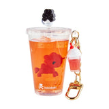 The tokidoki Beverage Besties Unicorno Blind Box keychain features a clear cup-shaped design with orange liquid, a mini red unicorn, drink charm, and gold clasp—perfect for any tokidoki fan or collectible lover.