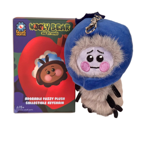 The Wooly Bear and Friends Plush Keychain Blind Box by Kaleidos Creative features a sad-faced plush with a blue hood, displayed in colorful packaging—an ideal collectible for fans of cute blind box surprises.