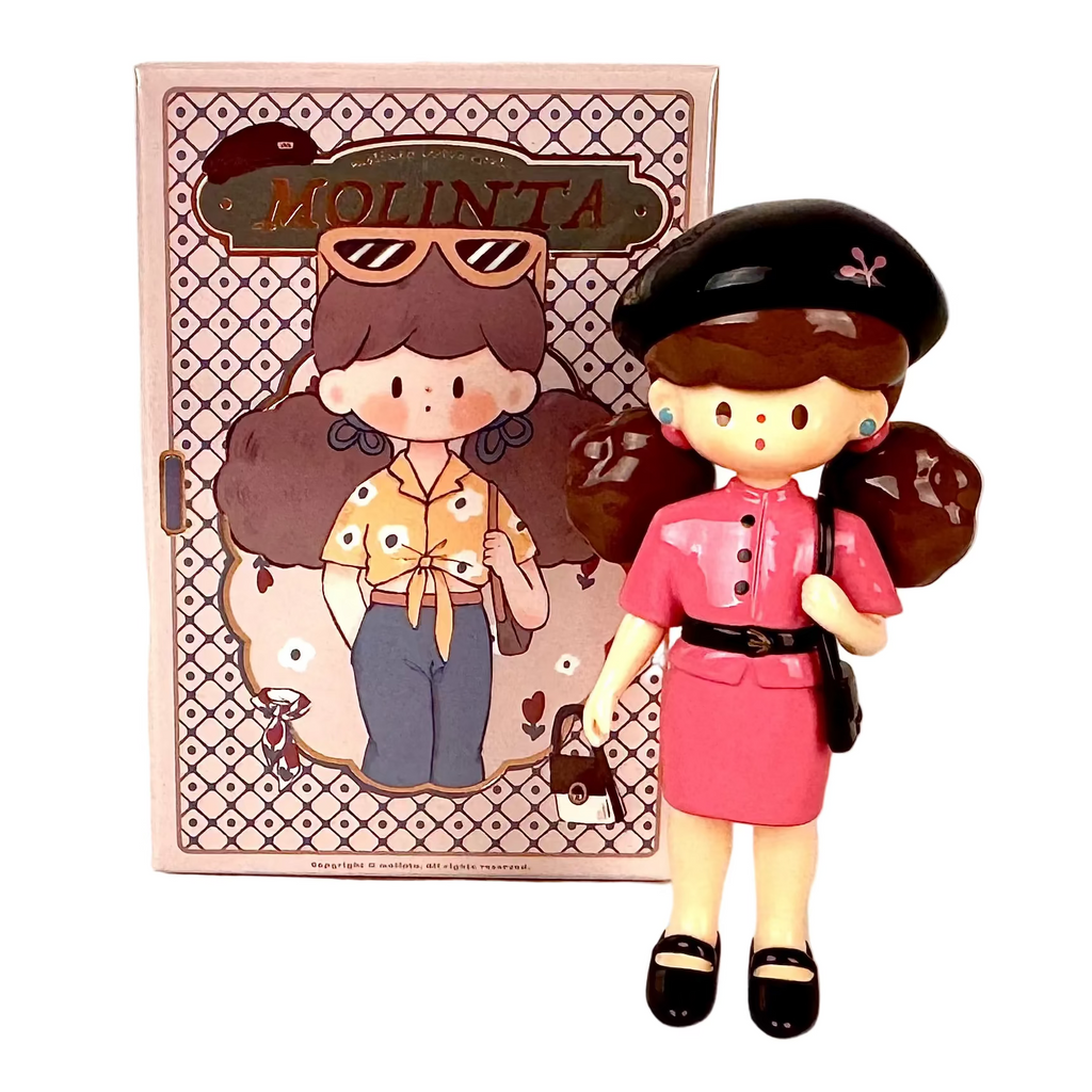 A stylish girl doll with brown hair, a black beret, and a pink outfit stands before a Finding Unicorn Molinta Retro Girls Blind box, which features an illustrated character wearing sunglasses and a yellow shirt.