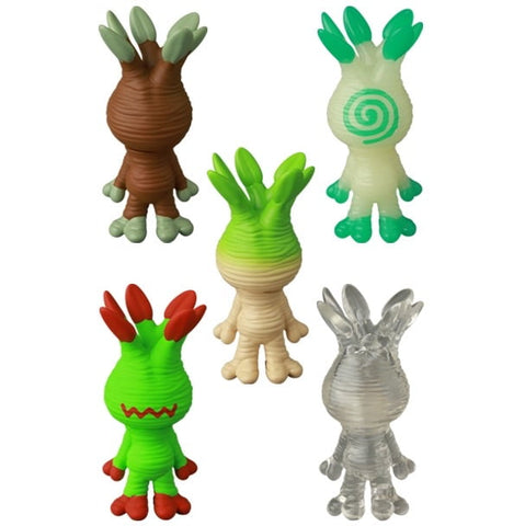 Five VAG 46 — Mandoraguraki figures by Medicom with textured bodies and pronged heads, shown from the back in brown, green, white, and transparent—ideal collectibles for Japanese vinyl toy gachapon fans.