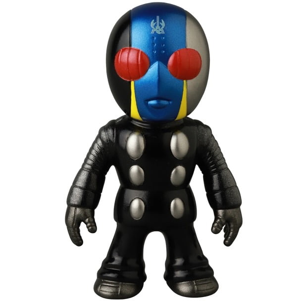 The Medicom VAG 46 — Tane Man is a Japanese vinyl toy figure featuring a black suit, metallic silver details, blue and silver head with red eyes, and yellow face stripes—perfect for fans of collectible Vinyl Artist Gacha gachapon.