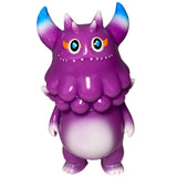 Rangeas Jr. - Purple by The Little Hut (HK) is a collectible toy monster figure with blue-tipped horns, orange eyebrows, two small fangs, and a white belly, standing upright on two legs.