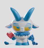 The Kid Krampus Blind Box by Kaleidos Creative features a stylized goat-like cartoon with blue horns, blue ruff, yellow eyes, holding a red object and blue chain—perfect as a collectible figure against a plain gray background.