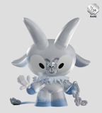 The Kid Krampus Blind Box by Kaleidos Creative features a stylized, translucent figure with large horns, icy blue-white hues, and crystal-like accents on hand and tail. A