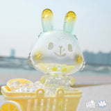 The Lemon Soda Robin by A Good Company (HK) is a translucent figurine with yellow-tinted ears, sitting in a cart filled with ice cubes and lemon slices—perfect as a charming home decor shelf ornament.