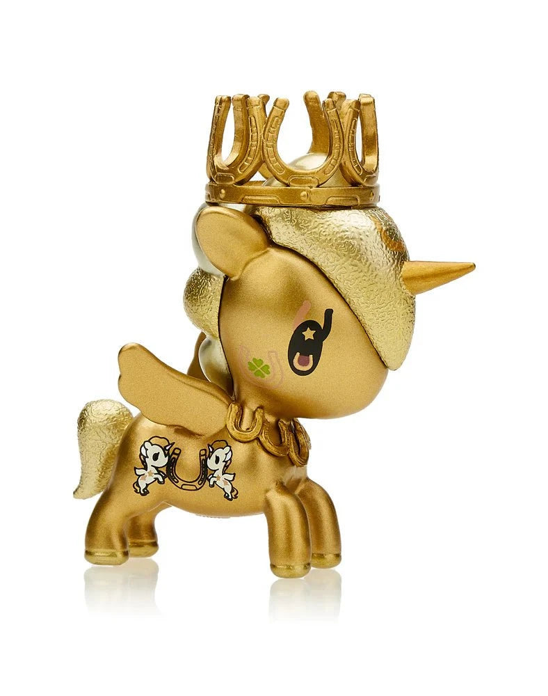 The Tokidoki Lucky Unicorno Blind Box, from the Tokidoki brand, is a golden unicorn figurine with a crown, showcasing detailed wings and a delightful horseshoe design on its side that promises good fortune with every look.