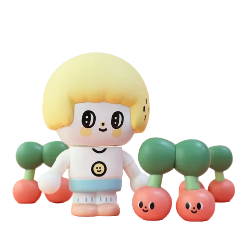 A smiling Morita Chen Good Friend toy by Partner Toys, with blond hair, stands among three pairs of cartoon-faced cherry buddies with green stems—a playful vinyl collectible.