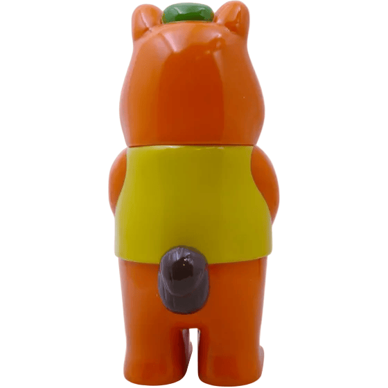 The Mamechan - #1 by Paradise Toy (TW) is an orange bear-like figure with a yellow vest, green cap, and small gray tail, shown from the back against a white background—an adorable addition to any tourist collectible collection.