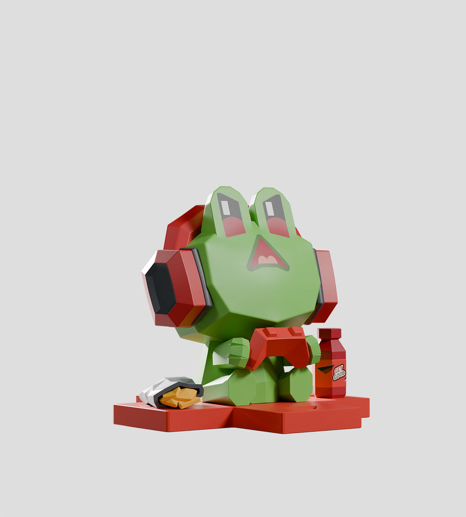 Part of Kaleidos Creative’s Mega-Mini Arcade Blind Box, this rare green frog figure with red headphones and controller sits on a red base next to a burger and drink—a standout collectible for any gamer.