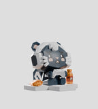 A rare Mega-Mini Arcade Blind Box figure by Kaleidos Creative: a polygonal bear with earmuffs, seated on a platform holding a cup, with a burrito and bottle nearby, shown against a plain gray background.