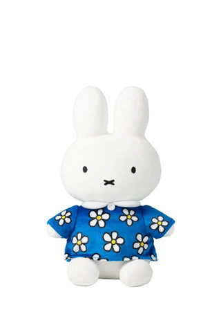 The Smoko Miffy Blue Daisy Midi Mochi Plush is a kawaii white bunny with upright ears, dressed in a blue outfit with white and yellow flowers, sitting facing forward against a plain white background.