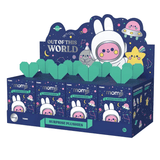 Momiji Out of This World Plush Blind Box by Momiji features adorable plush toys dressed as cartoon astronauts with stars and planets, all in a space-themed display on a dark blue background.