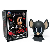 A vinyl collectible with big ears and bold eyes sits by its