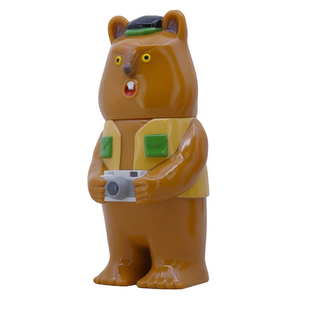 The Paradise Toy Mamechan- Milktea limited edition figure features a brown bear in a yellow vest and green cap, holding a camera, standing upright on a white background.