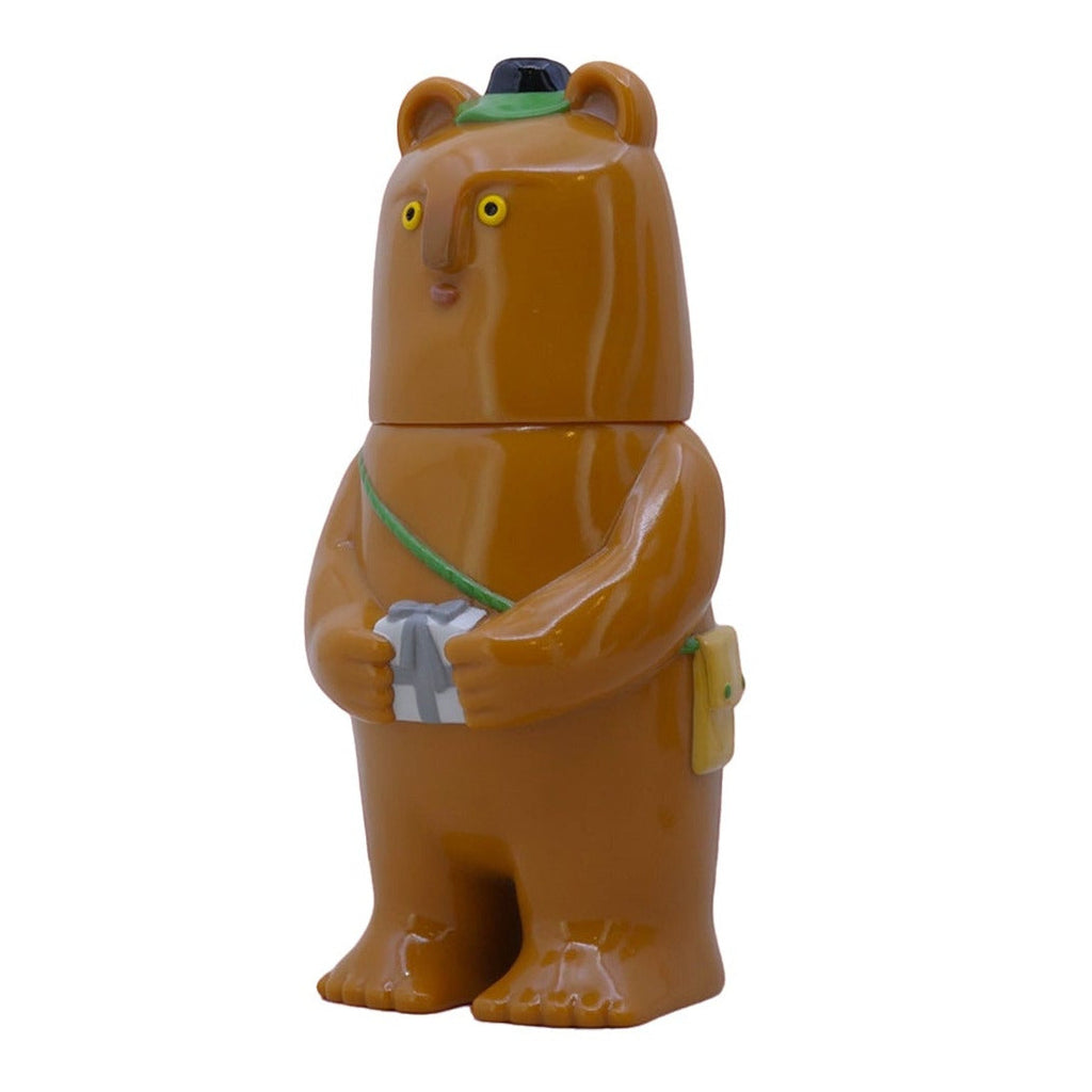 The Kurichan-Milktea brown bear figurine by Paradise Toy wears a green hat and sash, holds a gray camera, and stands upright on a white background—an ideal piece for any collectible plush display.