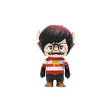 The Little Hut's Nick - Starbeast Adventure toy figure features a small monster with black hair, glasses, striped shirt, horns, and fangs, inspired by Shon Chen’s series and displayed against a white background.
