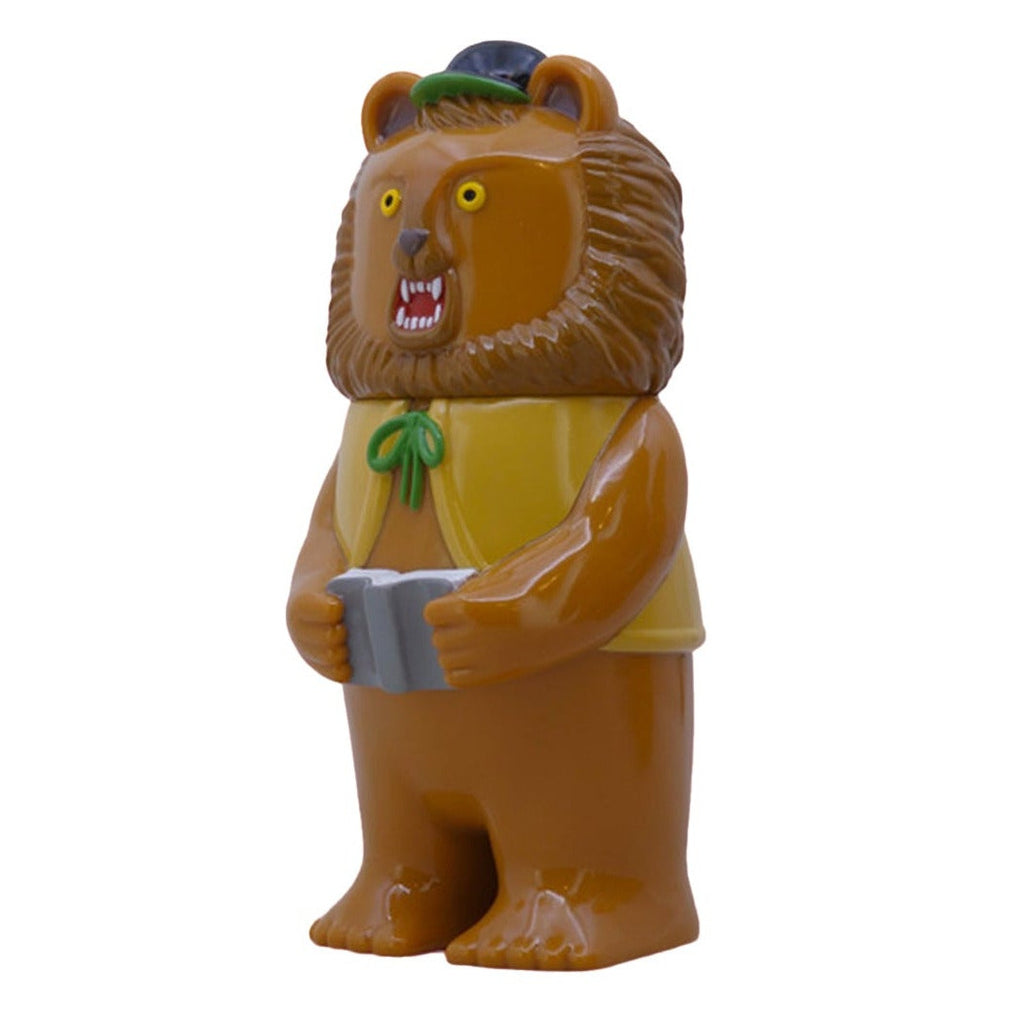 Morichan- Milktea by Paradise Toy is a plastic lion figurine in a milktea shade, with a yellow vest, green bow, black hat, and gray book. Stands upright on white background; perfect for collectors of Paradise Toy.