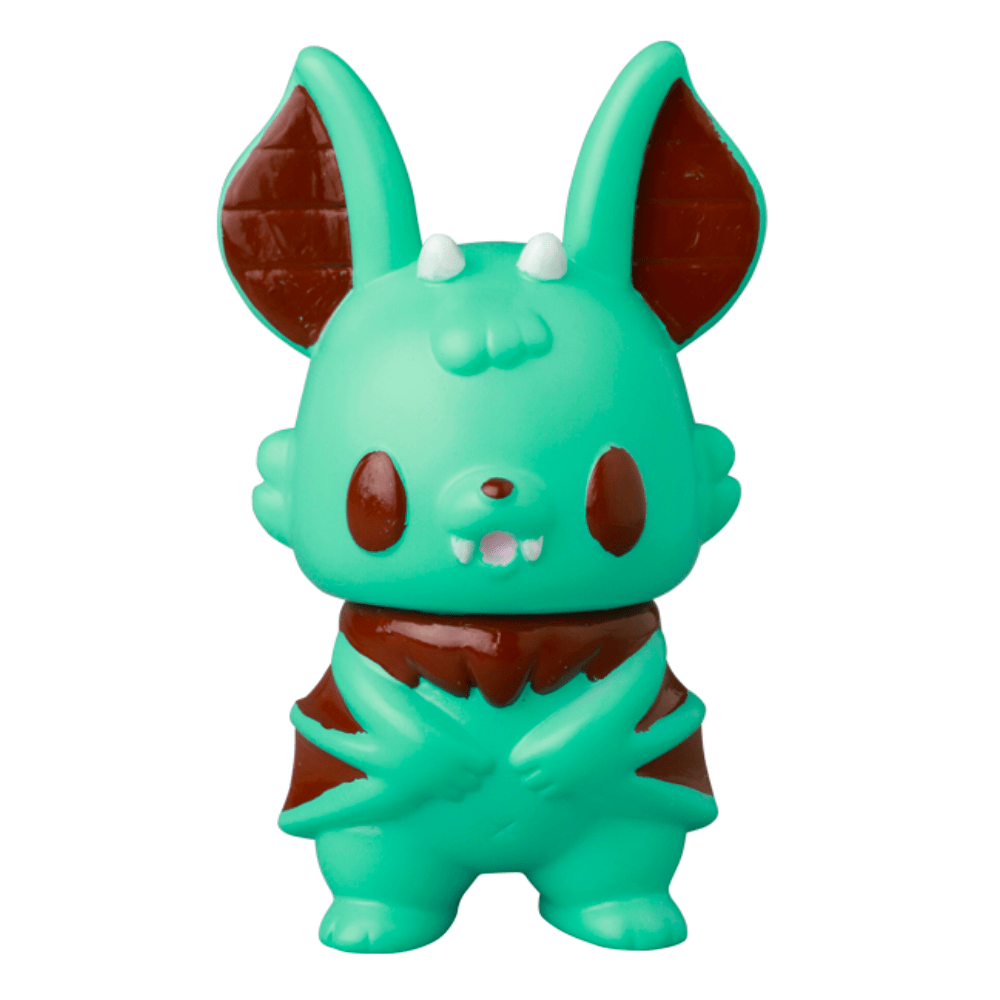 The VAG 10th Anniversary — Kopatapatan by Medicom (JP) is a small teal Japanese vinyl bat figure with large ears, small fangs, and brown accents—ideal for gachapon collectors, photographed upright against a white background.