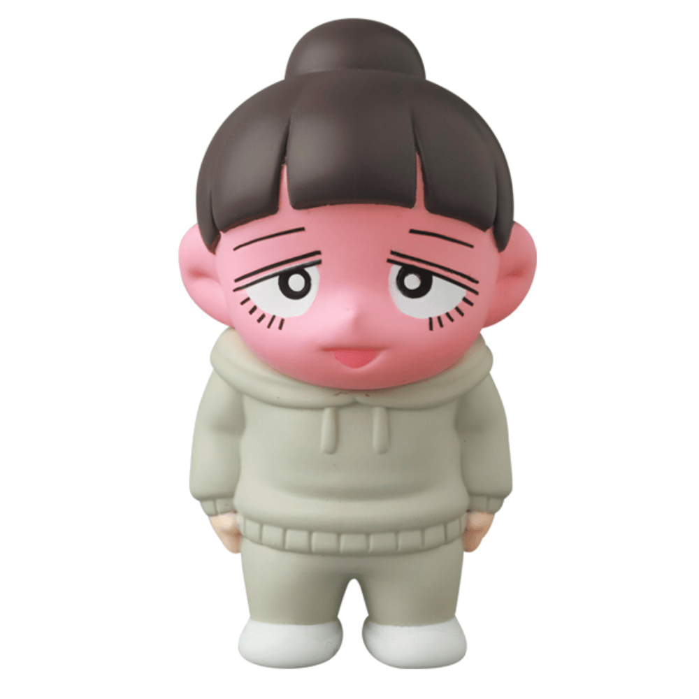 A silly pink Vag 35 - Inu No Kagayaki toy with a hoodie and brown hair sits on the work desk.