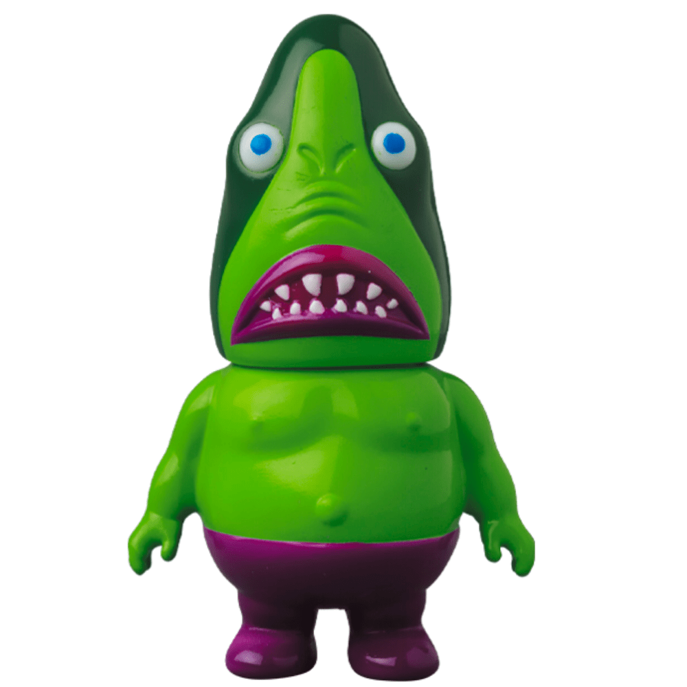 A green and purple Vag 35 - Samen Chu toy with a mouth sits on a shelf.