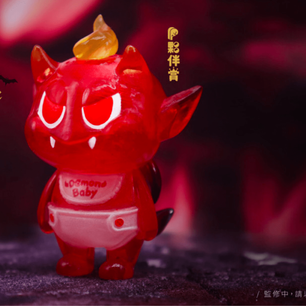 The Villain Baby - Blind Box by Partner Toys features a tiny devil figurine with a flaming head, horns, pointed ears, sharp teeth, and a