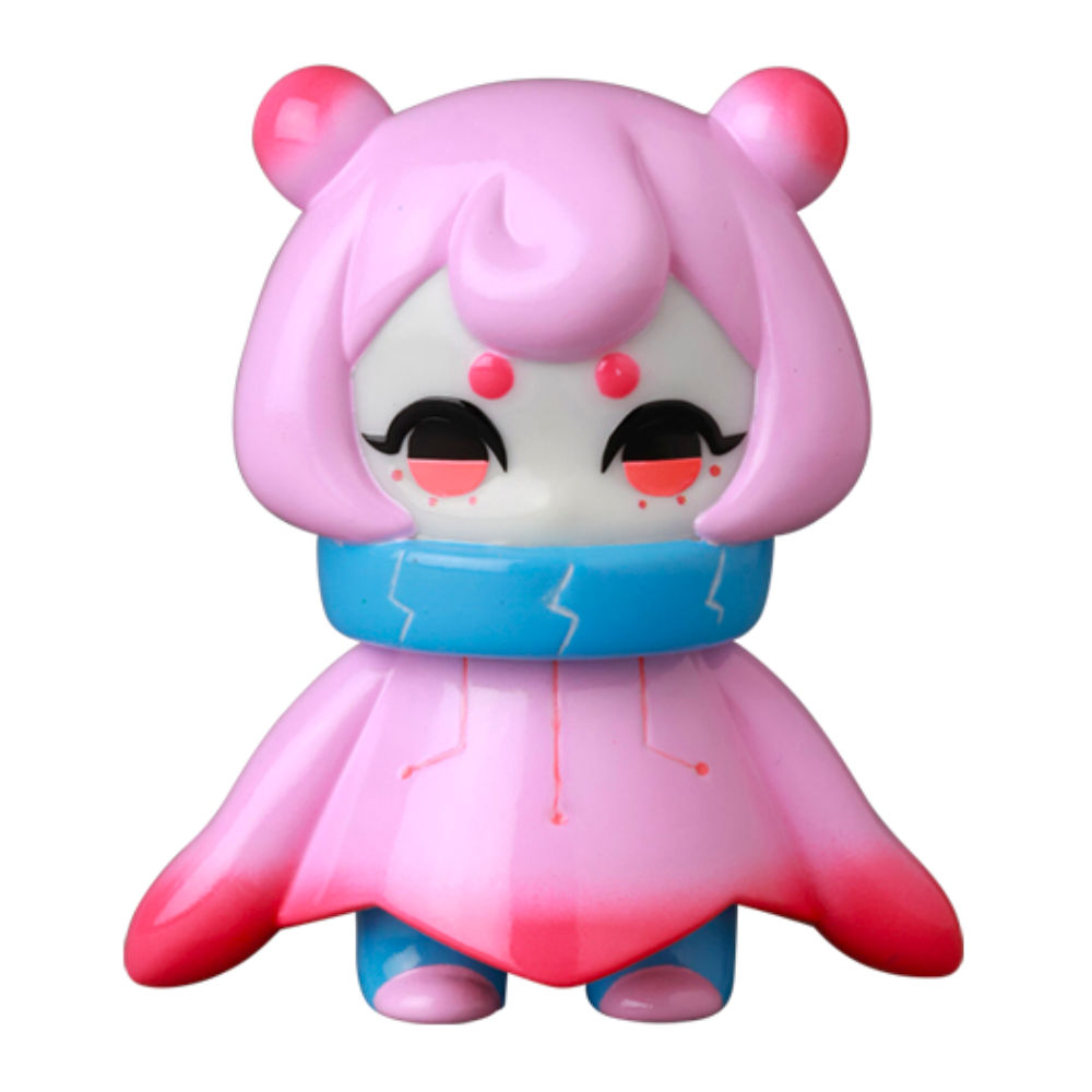 The VAG 10th Anniversary — Denshikodako by Medicom (JP) features a pink and blue cartoon figure with a large head, pink hair, red dots on its face, and a blue collar, resembling collectible Japanese vinyl gachapon toys.